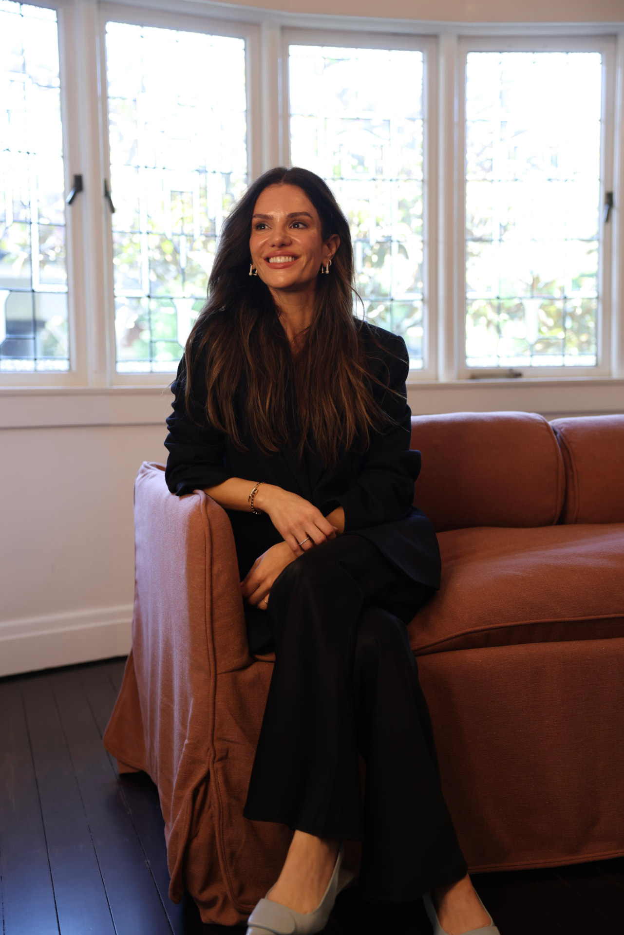 Dr Mayra seated in the clinic consulting room